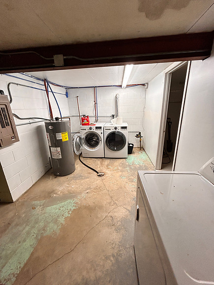 laundry with door to bedroom