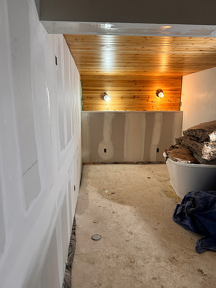 looking to the back of the bedroom