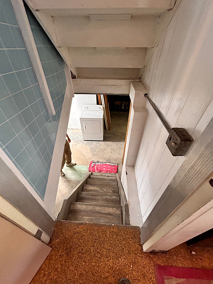 stairs to basement bedroom/ laundry/closets and second bathroom